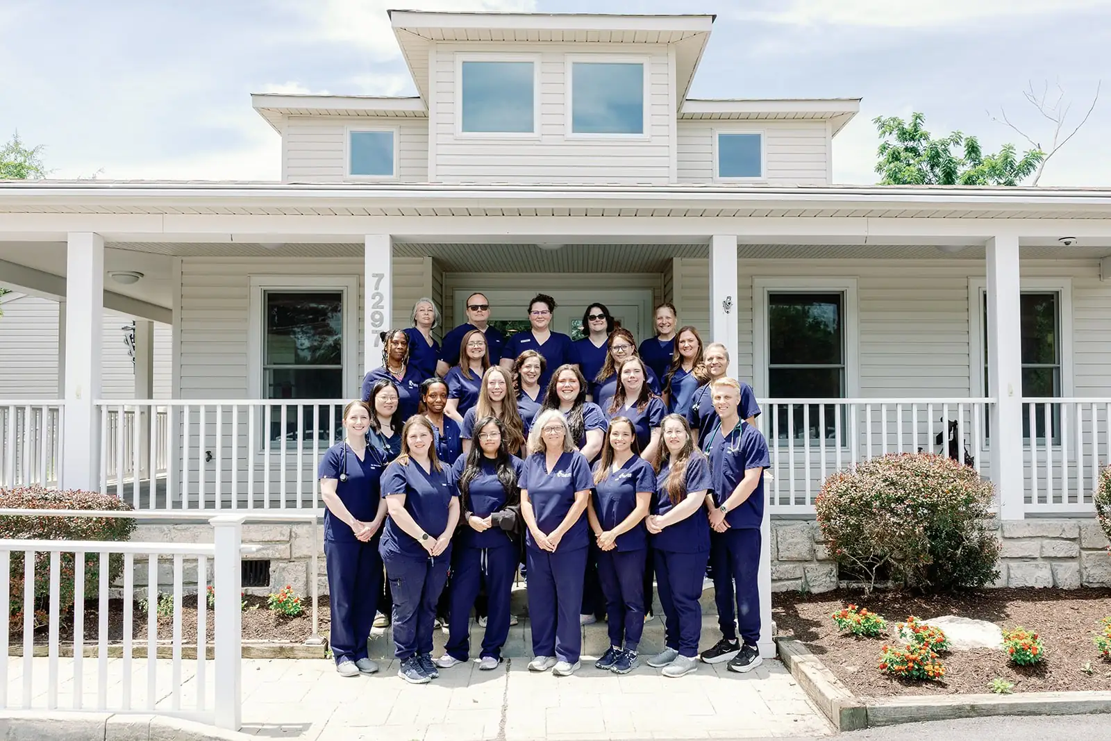 The Noah's Ark Veterinary Hospital team gathered on the front steps of the hospital in Williamsburg, Virginia